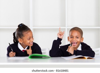 Cute Elementary School Kids In Classroom
