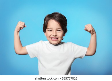 Cute emotional little boy on blue background - Shutterstock ID 535737016