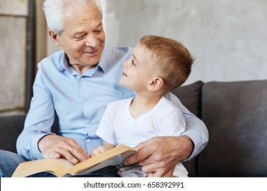 Cute Energetic Kid Enjoying Time With Grandpa