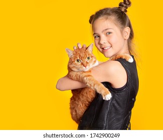 Cute European teen girl and red cat. A child and a cat on a yellow background. Pets, care for the animals. Cat care, veterinary medicine, animal feed.
 - Powered by Shutterstock