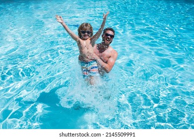 Cute Excited Child With Dad In Summer Swimming Pool. Happy Little Boy Stretching Out Hands While His Father Carrying Him In Swimming Pool.