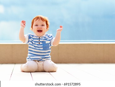 Cute Excited Toddler Baby Having Fun On Decking