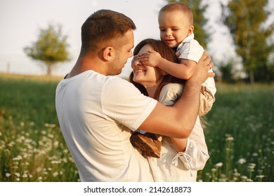 Cute Family Playing In A Summer Field