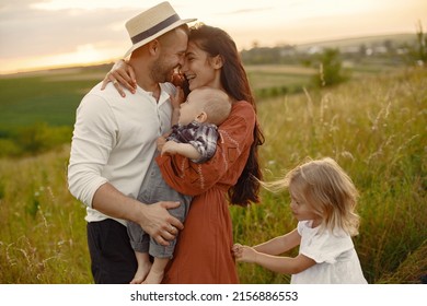 Cute Family Playing In A Summer Field