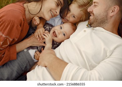 Cute Family Playing In A Summer Field