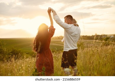 Cute Family Playing In A Summer Field