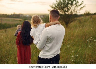 Cute Family Playing In A Summer Field