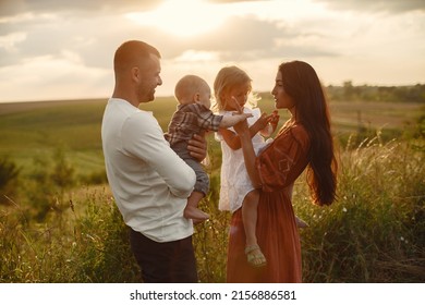 Cute Family Playing In A Summer Field