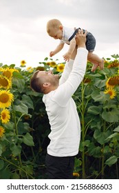 Cute Family Playing In A Summer Field