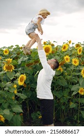 Cute Family Playing In A Summer Field