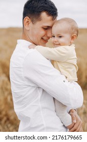 Cute Family Playing In A Summer Field