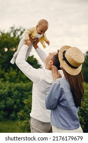 Cute Family Playing In A Summer Field