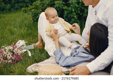 Cute Family Playing In A Summer Field