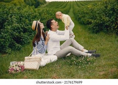 Cute Family Playing In A Summer Field