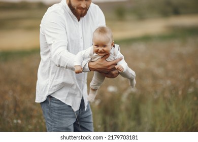 Cute Family Playing In A Summer Field