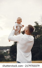 Cute Family Playing In A Summer Field