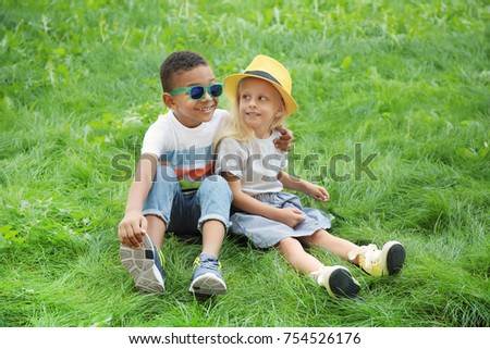 Similar – Vater und Sohn sitzen im Park.