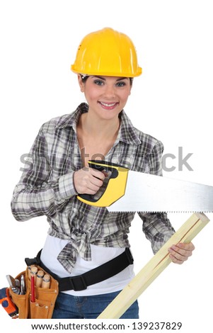 cute female carpenter using handsaw Stock photo © 