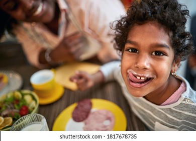 Cute Female Child Licking Her Lips After Tasty Diner