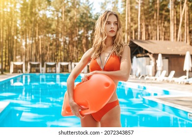 Cute Female Lifeguard Standing Near The Public Swimming Pool