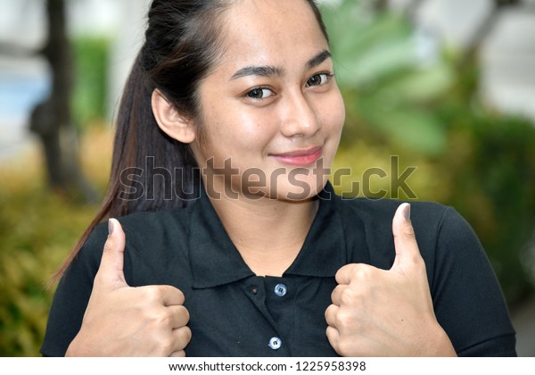 Cute Filipina Teen Girl With Thumbs Up