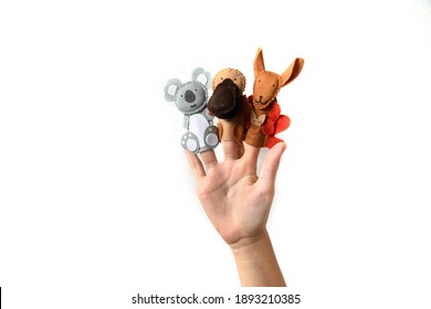 Cute finger puppet animals on hand isolated on a white background. Animals from Australia. 