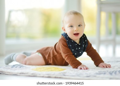 Cute Five Months Old Baby Boy Lying On His Tummy. Baby During Tummy Time. Cute Little Child Learning To Crawl.