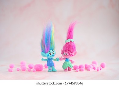 cute friends trolls on pink abstract background. Harper Pinsel and Queen Poppy - modern toy hasbro trolls. concept of children's games, fun, toys, friendship