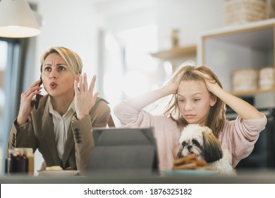 A Cute Frustrated Teenage Girl And Her Stressed Mother In The Morning At Home While Mom Getting Ready To Go To Work.