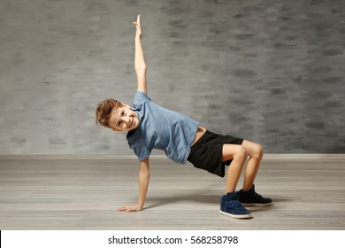 Cute funny boy in dance studio