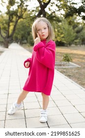 Cute Funny Child Girl 4-5 Year Old Wear Bright Pink Sweater Having Fun Playing In Park Outdoor. Childhood. Autumn Season. 