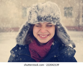 Cute Funny Happy  Girl In A Fur Cap  Laughing Under The Snow, Image With Instagram Retro Effect