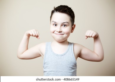 cute funny kid flexing biceps