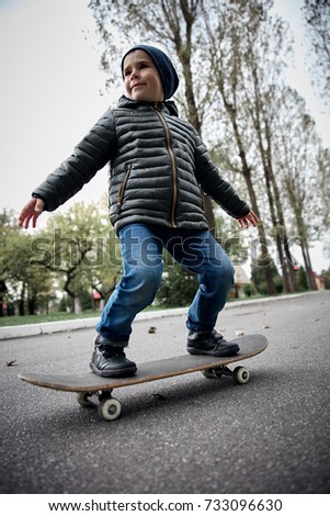 Similar – teenager practicing with skateboard at sunrise city