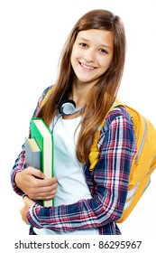 Cute girl with books smiling at camera in isolation