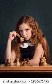 Cute Girl Chess Player Playing Chess On A Dark Background
