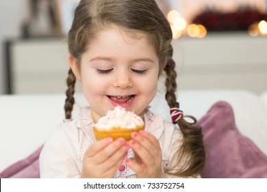 Cute Girl Eating Muffin