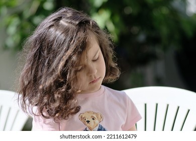 Cute Girl Eating Pita In The Backyard