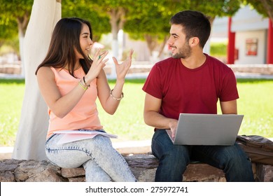 Cute Girl And A Friend Of Hers Hanging Out And Talking About Their Recent School Project