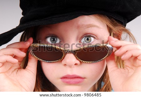 Cute Girl in Hat and Sunglasses