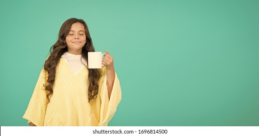 Cute Girl Hold Coffee Cup. Good Morning Drink. Small Kid Blue Wall. Little Girl Drink Cocoa Milk Before Sleeping. Cosy Fluffy Pajama. Feeling Comfortable At Home. Copy Space. Happy Girl With Tea Cup.