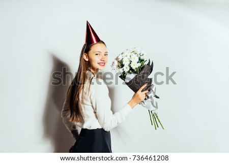 cute girl holding a bouquet of flowers. Beautiful white daisies. Happy Birthday. Isolated on white background.