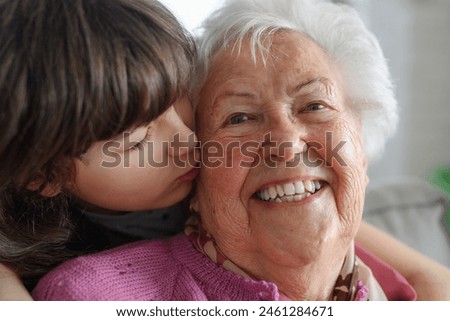 Similar – Image, Stock Photo Grandma cuddles up with her grandson