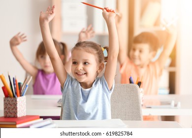 Cute girl at lesson in classroom - Powered by Shutterstock