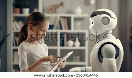 A cute girl is playing with a robot. The concept of future training. 