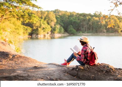 Cute Girl Reading A Book .