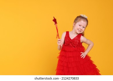 Cute Girl In Red Dress With Diadem And Magic Wand On Yellow Background, Space For Text. Little Princess