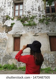 The Cute Girl With Red Shirt, Stand Back And Take A Picture In Front Of LHONG 1919 Chinese Architecture Art Building