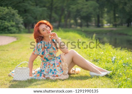 cute girl in retro dress enjoying life in city Park in summer