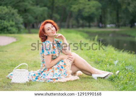cute girl in retro dress enjoying life in city Park in summer